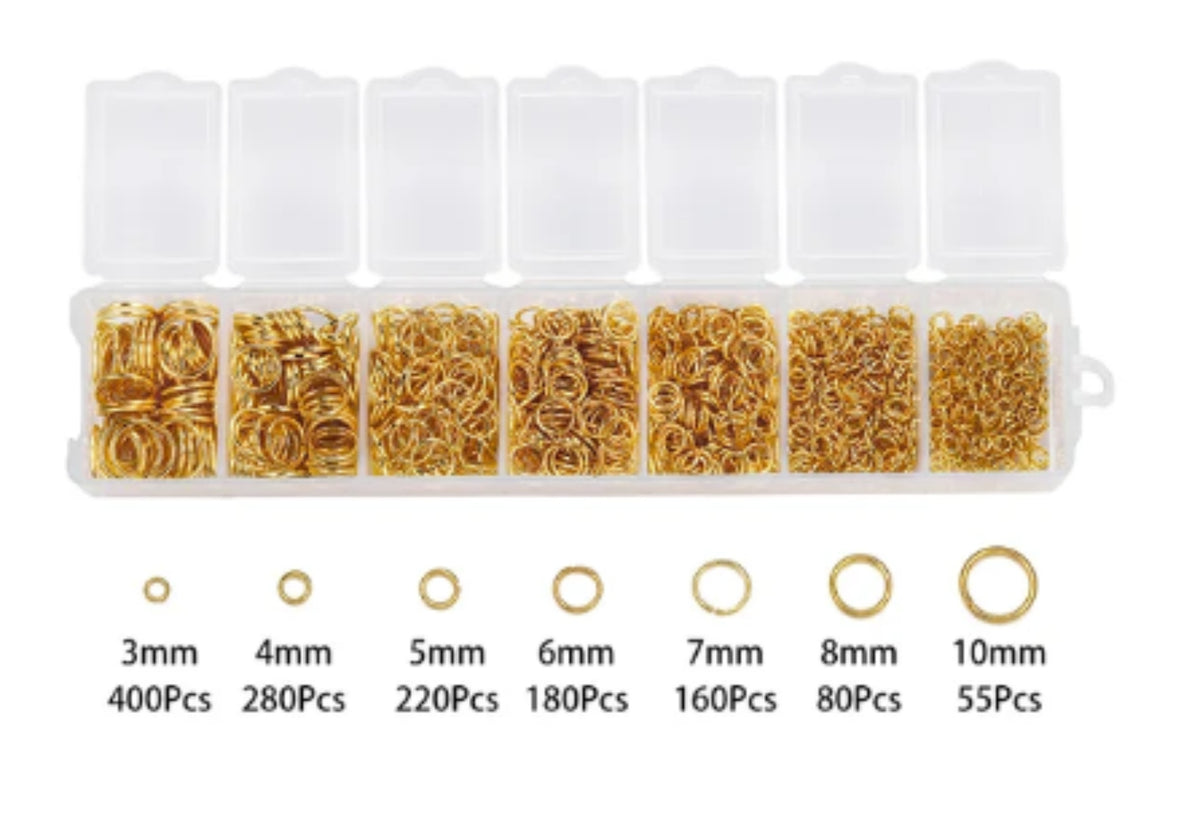 Clear divided case of gold jump rings in seven sizes from 3mm to 10mm, with size labels