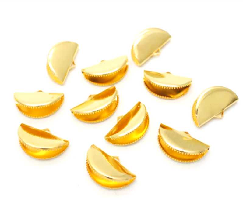 Pile of gold pinch crimp ends in 13mm and 20mm sizes on a white background