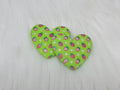 Pair of 37mm resin heart cabochons (cabs) in lime green with a red strawberry and white flower pattern
