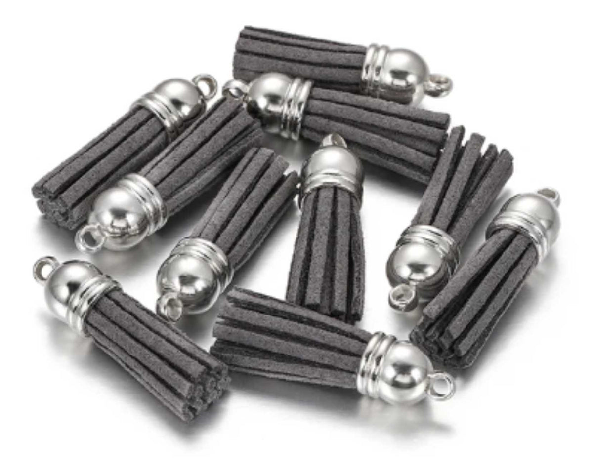 Pile of 38mm grey leather fringe tassels with silver-tone caps and loops