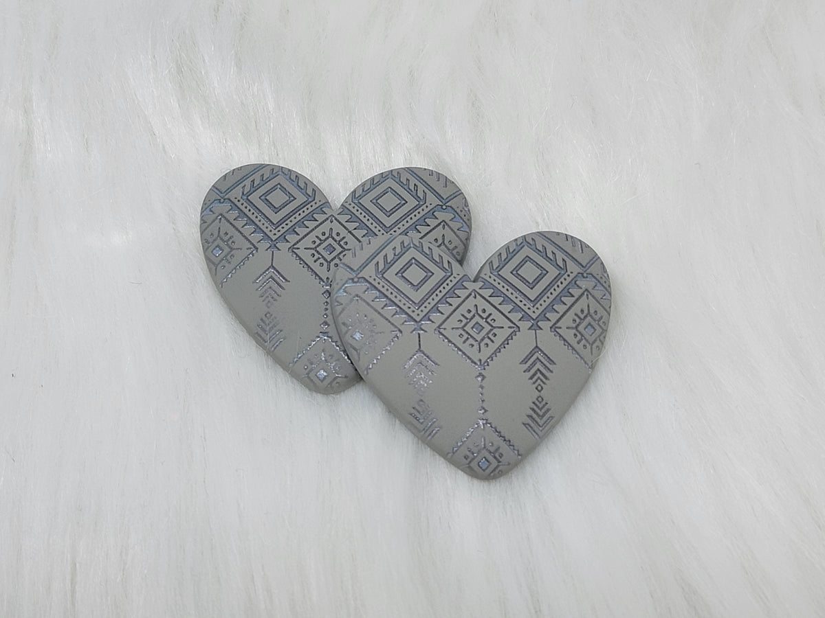 Pair of 37mm resin heart cabochons (cabs) in matte grey with an embossed geometric pattern