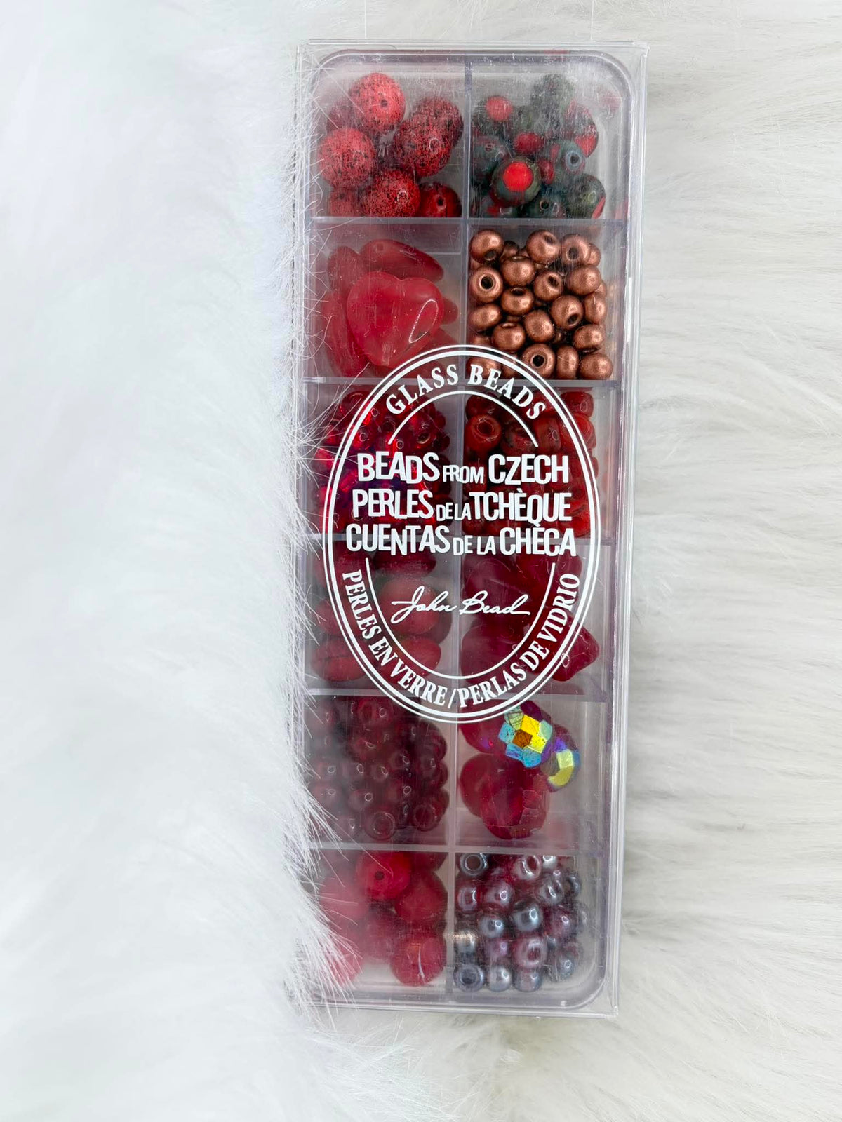Divided case of assorted Czech glass beads, Bologna City, in reds, browns and copper