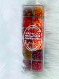 Divided case of assorted Czech glass beads, Sunset In Venice, in reds, oranges and burgundy