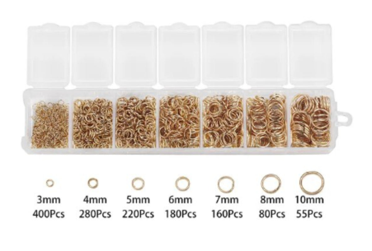 Clear divided case of KC Gold jump rings in seven sizes from 3mm to 10mm, with size labels