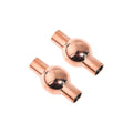 Two rose gold 4mm round magnetic clasps with tube ends on a white background