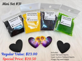 Mini set #31: black hearts, a pair of sunflower hearts and four bags of black, yellow, navy and green seed beads