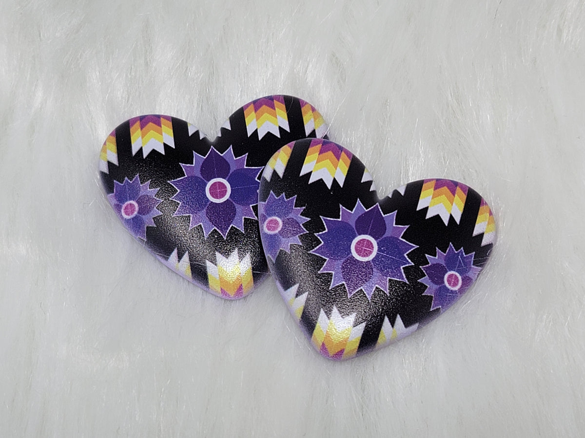 Pair of 37mm resin heart cabochons (cabs) in black with purple star flowers and rainbow zigzag accents