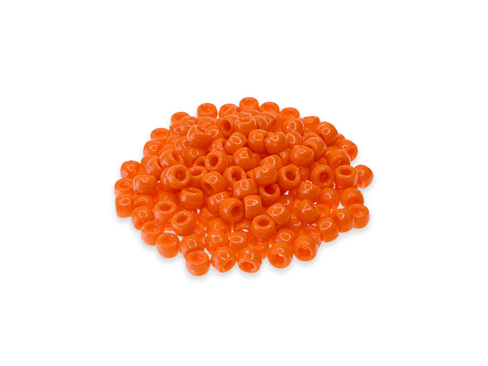 Pile of 6 x 9mm plastic pony beads in orange on a white background