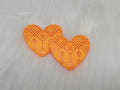Pair of 37mm resin heart cabochons (cabs) in orange with an embossed geometric pattern