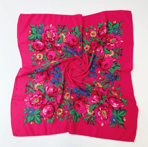 27 x 27 inch hot pink kokum scarf laid flat with a border of pink roses, blue flowers and green leaves