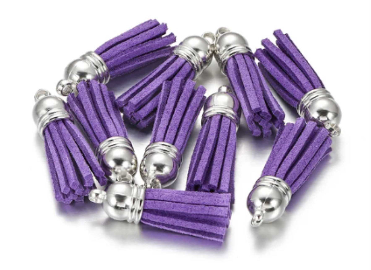 Pile of 38mm purple leather fringe tassels with silver-tone caps and loops