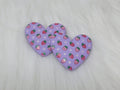 Pair of 37mm resin heart cabochons (cabs) in lilac with a red strawberry and white flower pattern