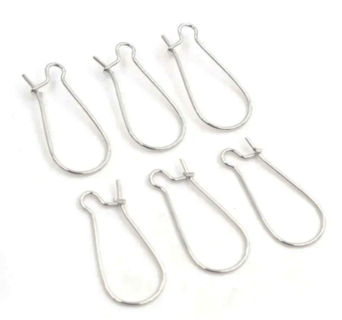 Group of rhodium kidney wire earring hooks in three sizes, laid out on a white background