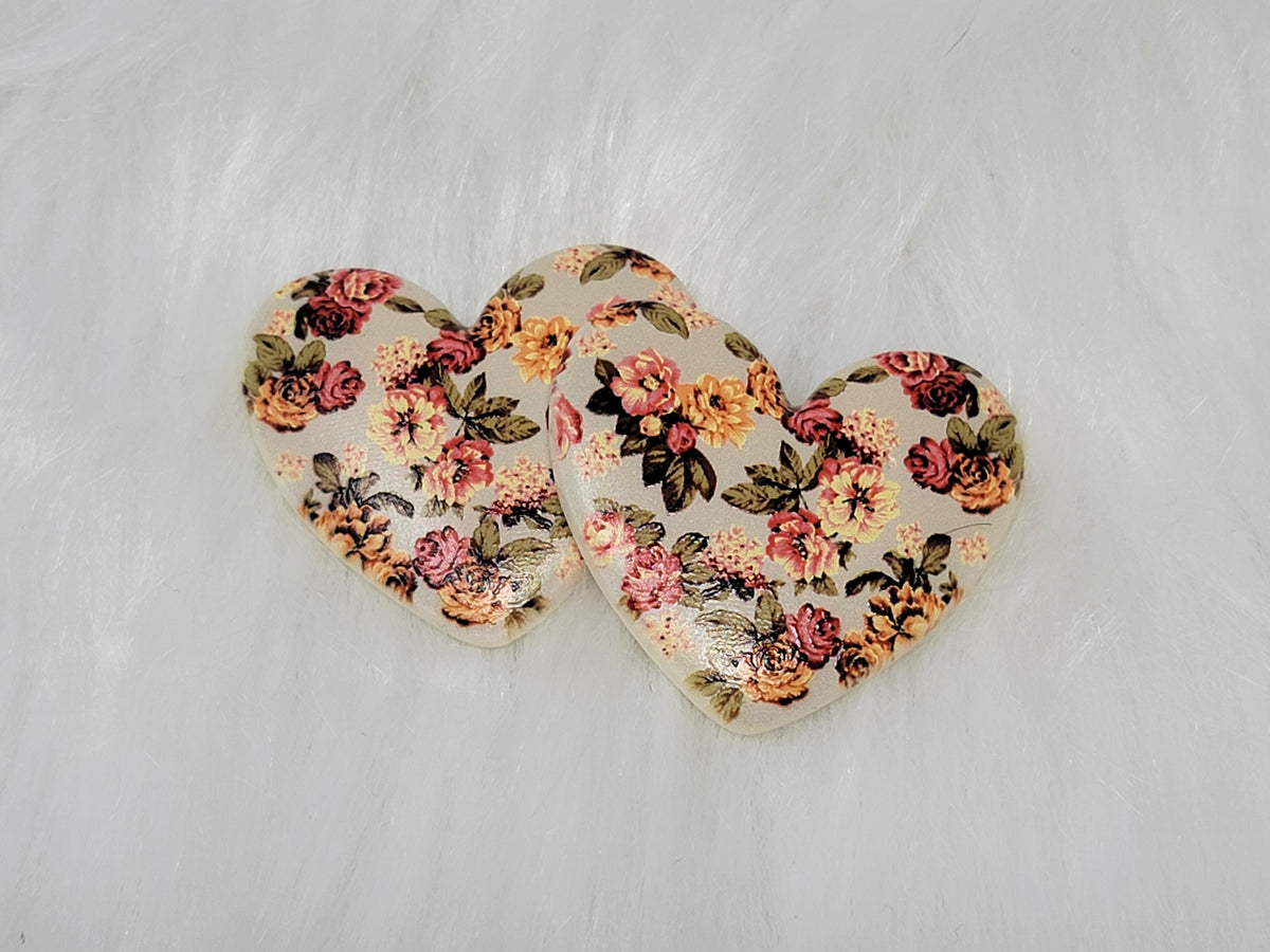 Pair of 37mm resin heart cabochons (cabs) in cream with a small rose and orange floral pattern