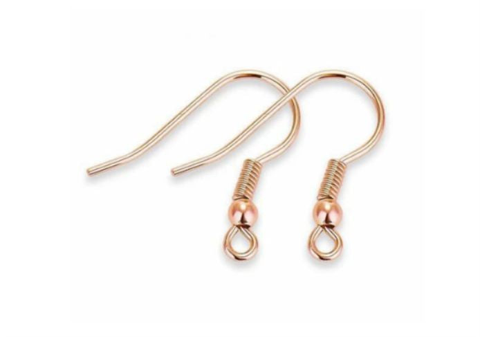 Pair of rose gold shepherd earring hooks with coil and bead on a white background