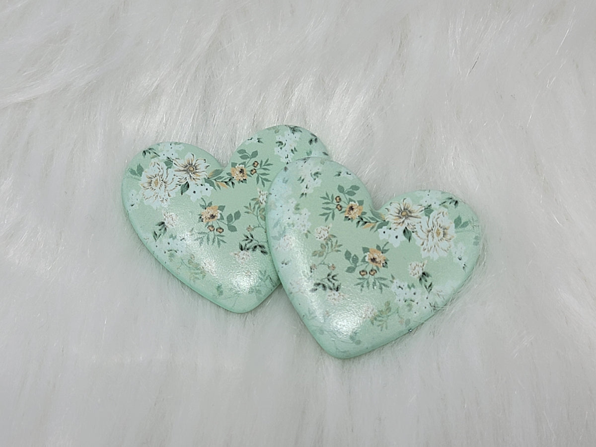 Pair of 37mm resin heart cabochons (cabs) in sage green with a small white and peach floral pattern