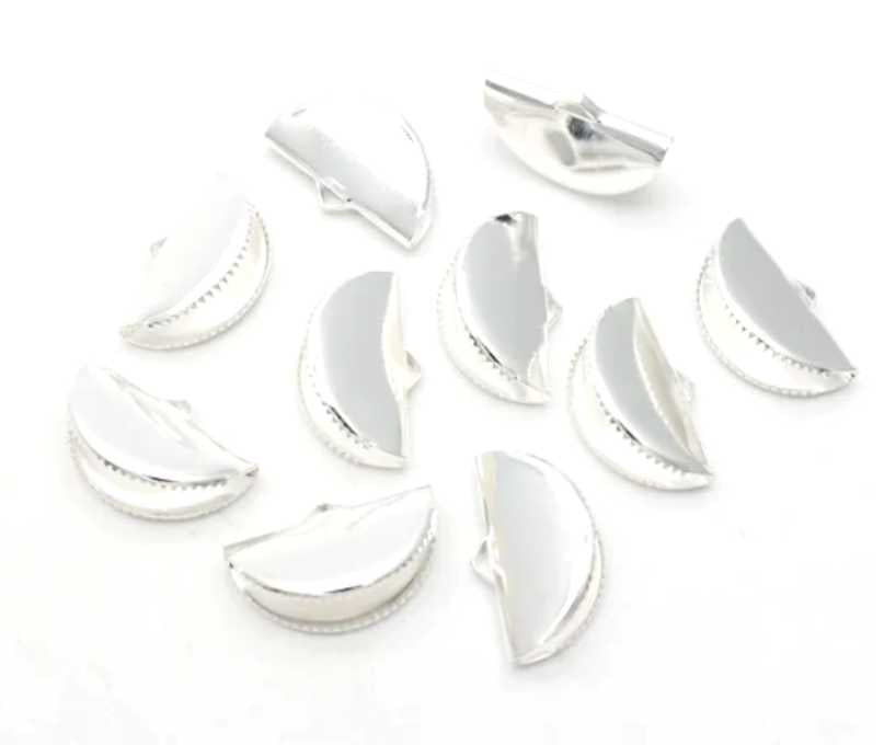 Pile of silver pinch crimp ends in 13mm and 20mm sizes on a white background