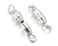 Two silver barrel swivel clasps with a loop at each end, on a white background