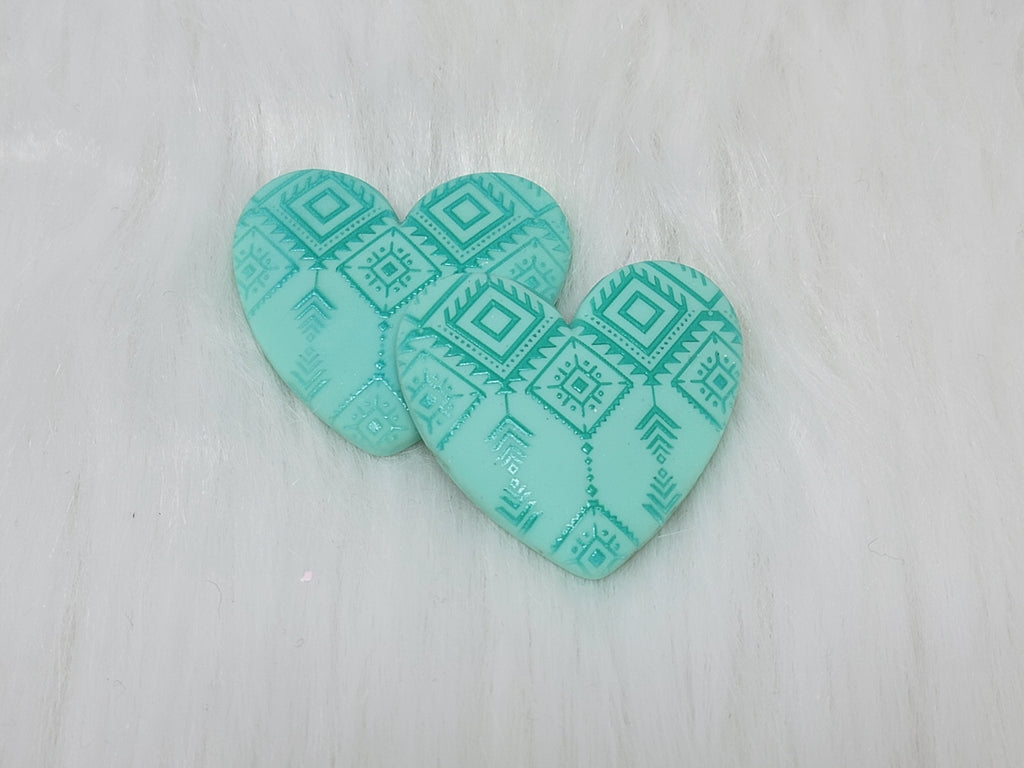 Pair of 37mm resin heart cabochons (cabs) in turquoise with an embossed geometric pattern