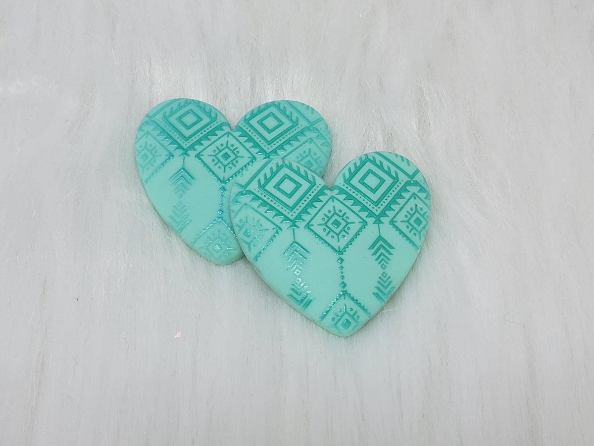 Pair of 37mm resin heart cabochons (cabs) in turquoise with an embossed geometric pattern