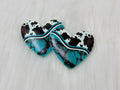 Pair of 37mm resin heart cabochons (cabs) with a turquoise stone and black and white cowhide print