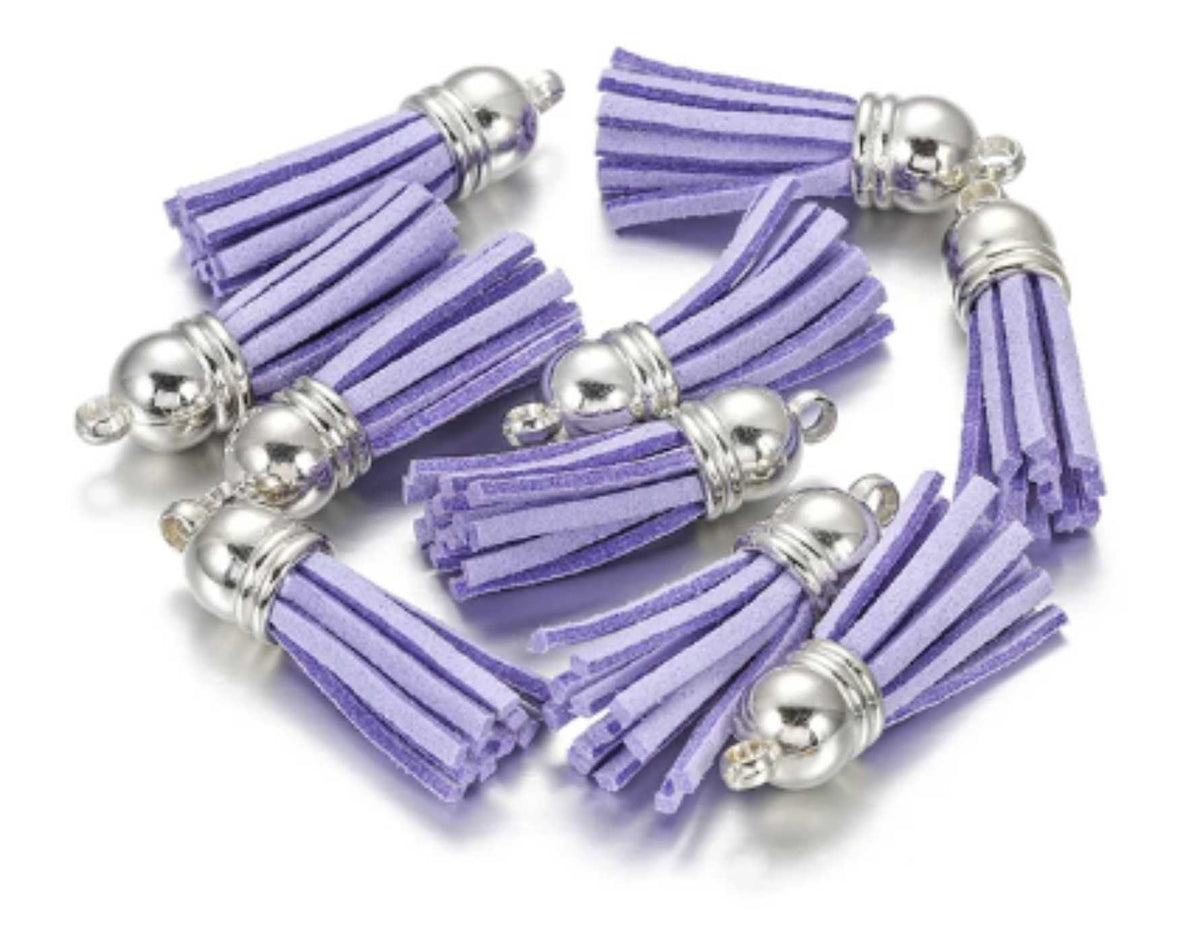 Pile of 38mm violet leather fringe tassels with silver-tone caps and loops