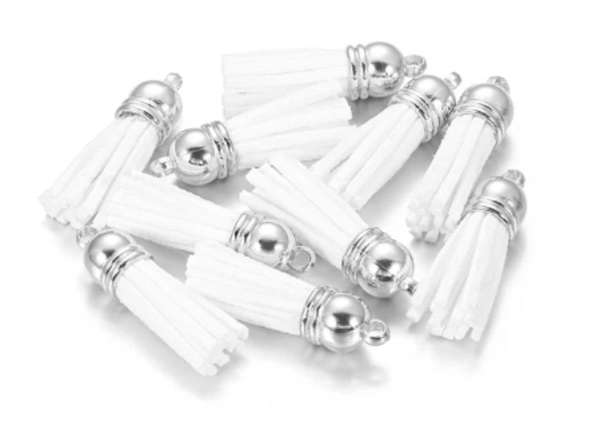 Pile of 38mm white leather fringe tassels with silver-tone caps and loops