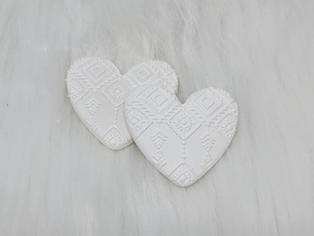 Pair of 37mm resin heart cabochons (cabs) in white with an embossed geometric pattern