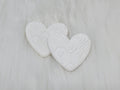 Pair of 37mm resin heart cabochons (cabs) in white with an embossed geometric pattern