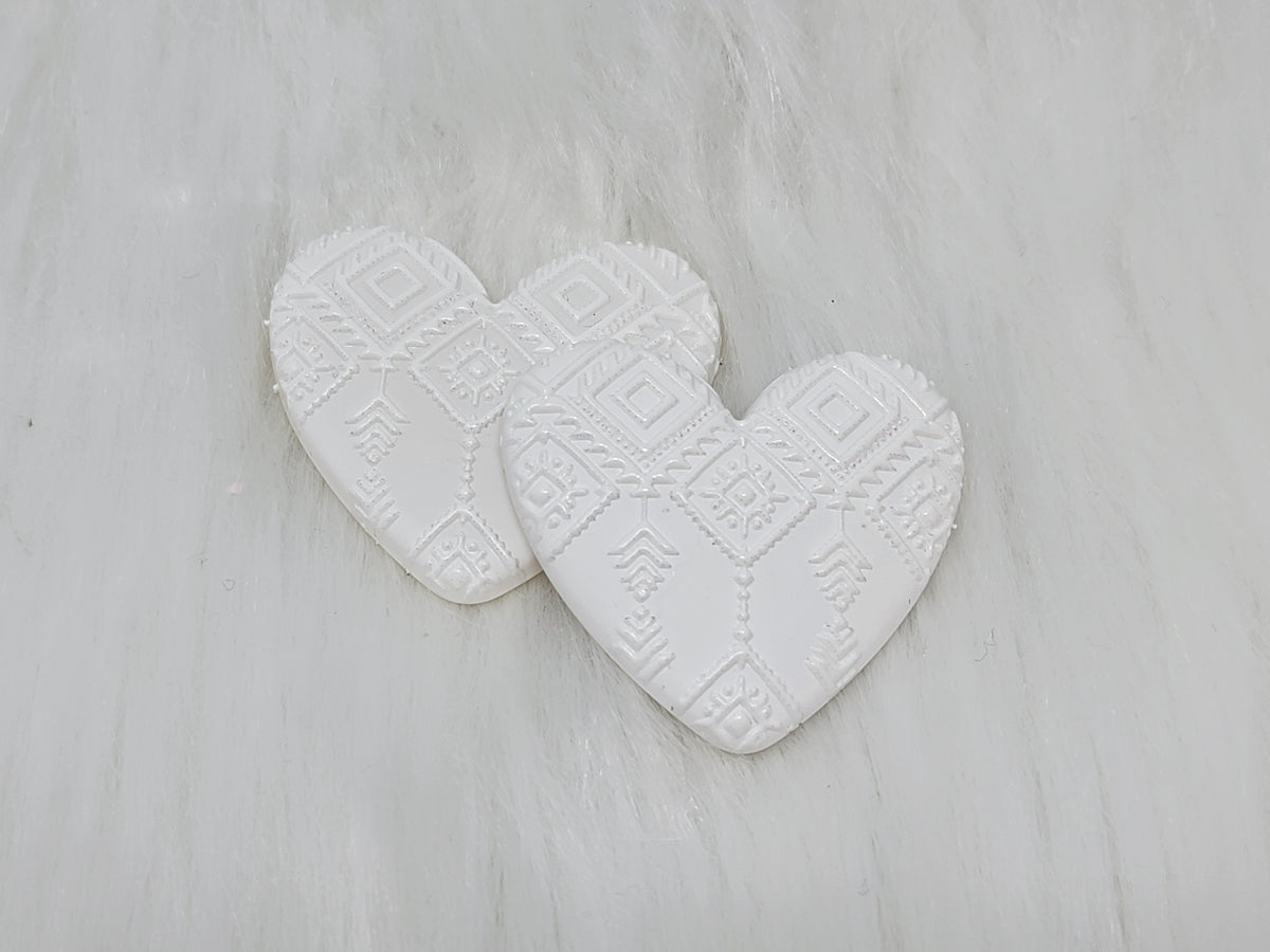 Pair of 37mm resin heart cabochons (cabs) in white with an embossed geometric pattern