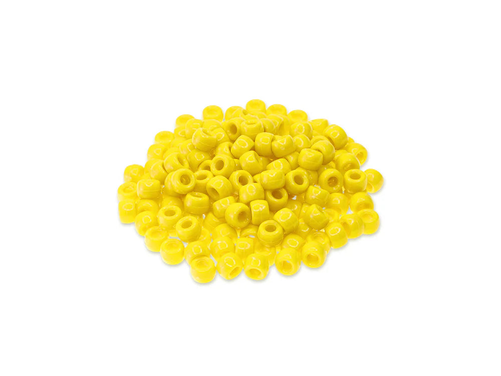 Pile of 6 x 9mm plastic pony beads in yellow on a white background