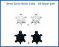 Two pairs of 12mm glittery resin turtle cabochons (cabs), one silver pair and one black pair