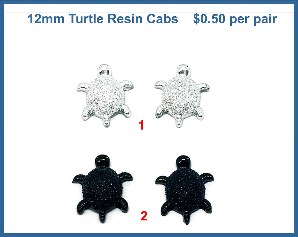 Two pairs of 12mm glittery resin turtle cabochons (cabs), one silver pair and one black pair