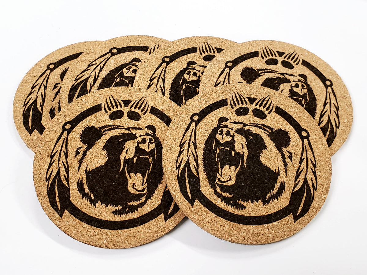 Stack of round cork coasters printed in black with a roaring bear face