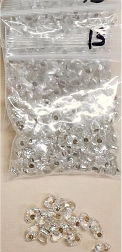 Bag of long magatama beads in silver-lined marked #13, with loose beads in front