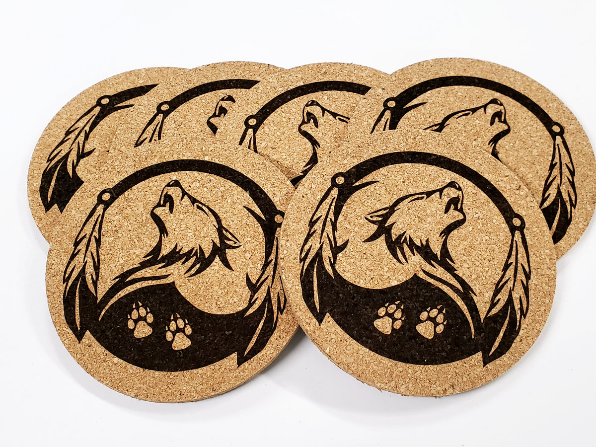 Stack of round cork coasters printed in black with howling wolves and paw prints