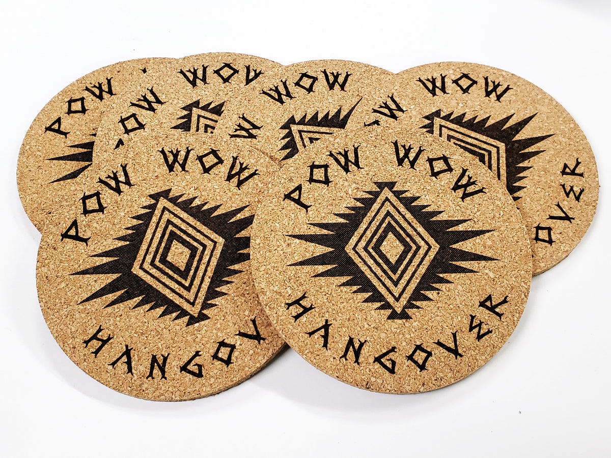 Stack of round cork coasters printed with the words 'Pow Wow Hangover' around a diamond