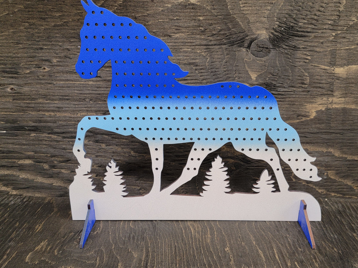 Horse-shaped earring display rack with rows of holes, in blue to light blue to white