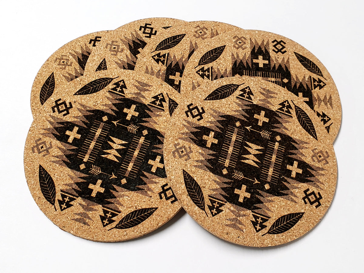 Stack of round cork coasters printed in black with a geometric diamond pattern