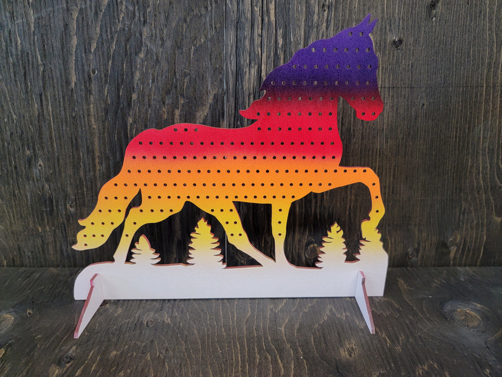 Horse-shaped earring display rack with rows of holes, in sunset purple, red, orange and yellow