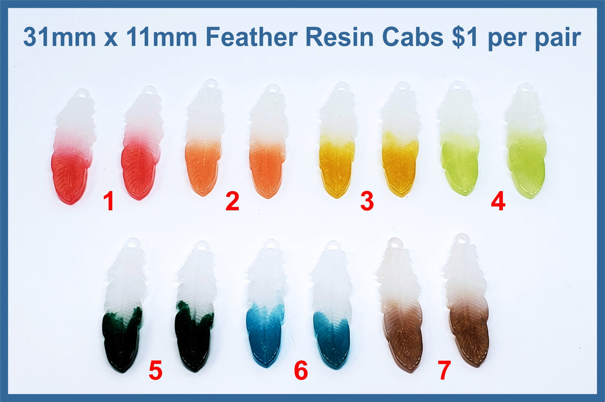 Seven pairs of 31mm x 11mm resin feather cabochons (cabs) in white fading to red, orange, yellow, green, teal and brown