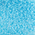 Close-up of Miyuki Delica 11/0 DB0725 cylinder beads in opaque light blue