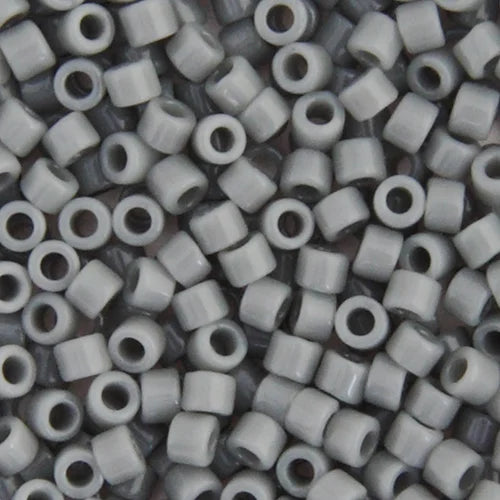 Close-up of Miyuki Delica 11/0 DB0731 cylinder beads in opaque grey
