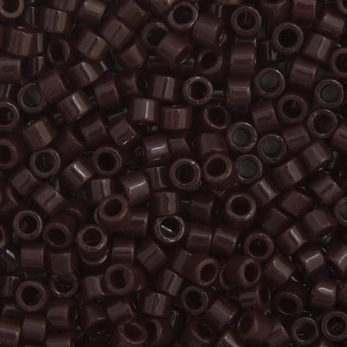 Close-up of Miyuki Delica 11/0 DB0734 cylinder beads in opaque chocolate brown