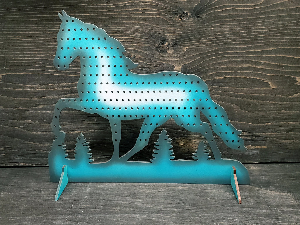 Horse-shaped earring display rack with rows of holes, in white, turquoise and grey