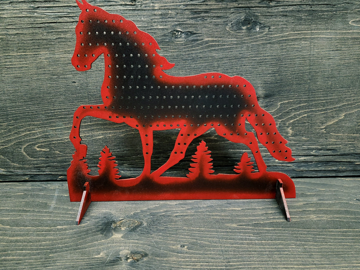 Horse-shaped earring display rack with rows of holes, in red with a black centre