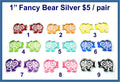 Nine pairs of 1 inch silver mirror acrylic bear cabochons (cabs) with engraved swirls in rainbow colours