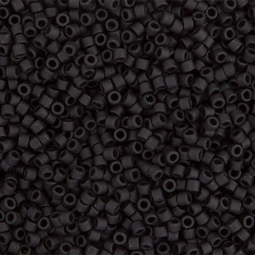 Close-up of Miyuki Delica 11/0 DB0310 cylinder beads in matte black