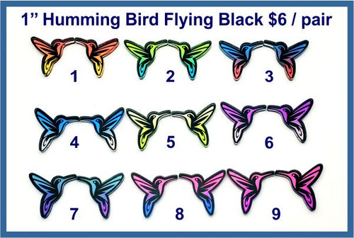 Nine pairs of 1 inch black acrylic flying hummingbird cabochons (cabs) with engraved wings in bright colours