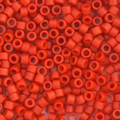 Close-up of Miyuki Delica 11/0 DB0795 cylinder beads in matte orange cinnabar